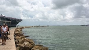 Man's body found floating near USS Lexington